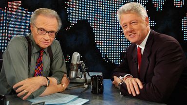 Former President Bill Clinton (R) speaks with Larry King on CNN in New York on September 3, 2002